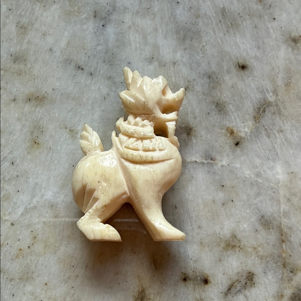 Carved Cream Figurine
